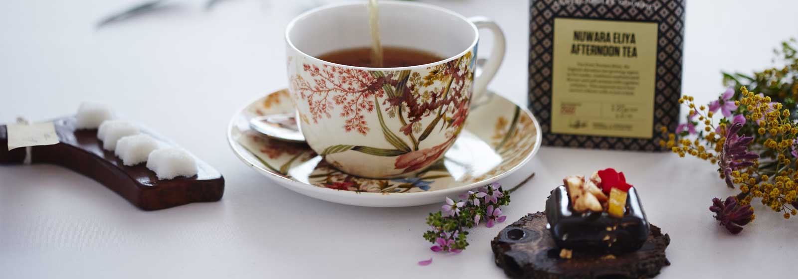 Tea Being Poured into a Well Designed Cup