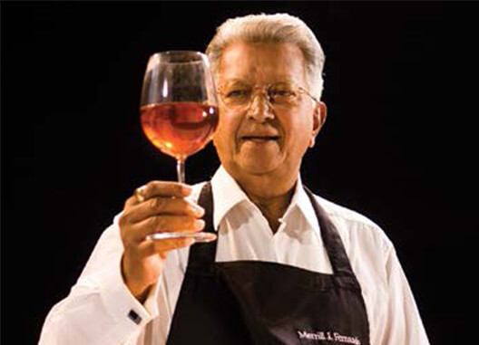 Dilmah Founder Meril J. Fernando Holding a Glass Filled with Tea