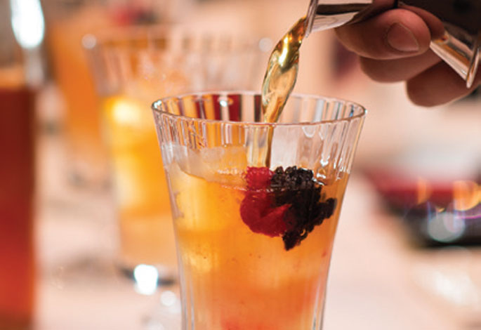 Pouring Tea Into Glasses