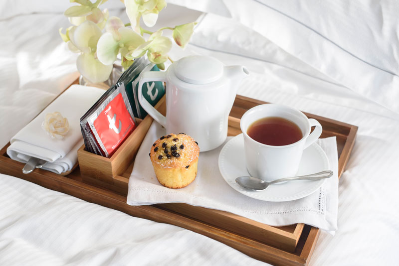 Soft white porcelain tea pot and cup for in-rooms