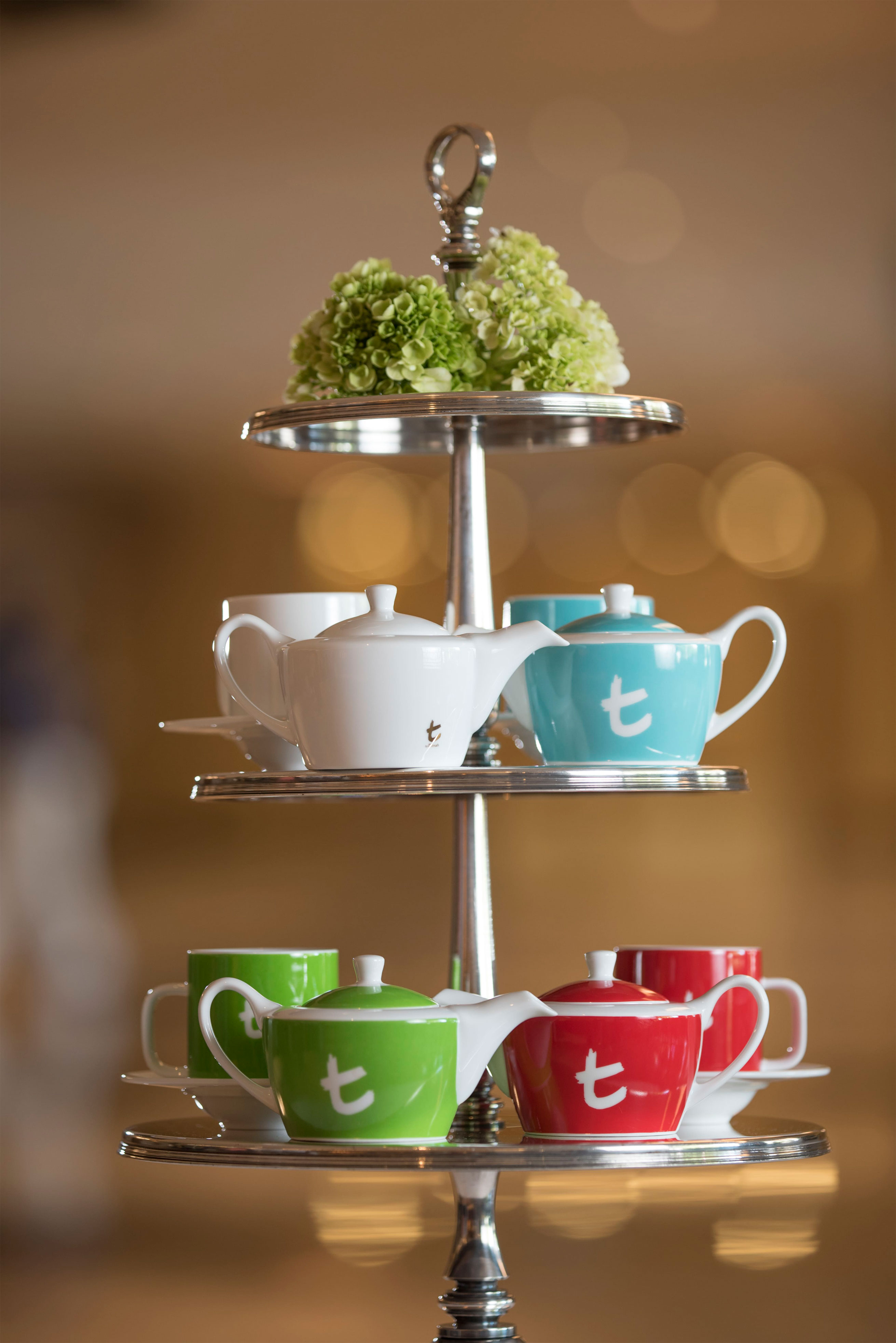 The lively and vibrant tea pots and cups features a contemporary tea presentation that invites guests to a delightful experience