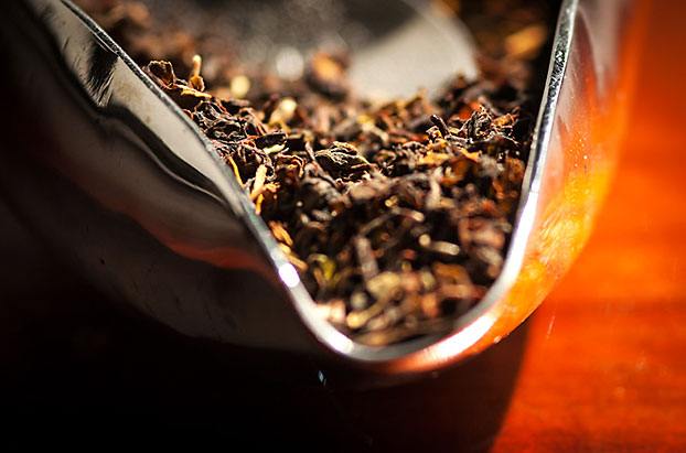 Opened Container of Dried Tea Leaves Dried Tea Leaves in a Opened Container